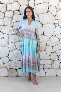 Womens super soft, lightweight, tunic style long length tie dye dress in aqua blue featuring 3/4 length trumpet sleeves and side pockets