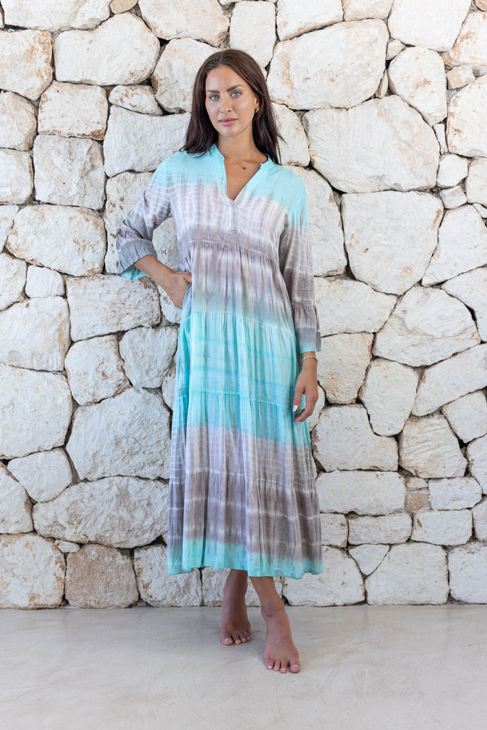Womens super soft, lightweight, tunic style long length tie dye dress in aqua blue featuring 3/4 length trumpet sleeves and side pockets