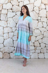 Womens super soft, lightweight, tunic style long length tie dye dress in aqua blue featuring 3/4 length trumpet sleeves and side pockets
