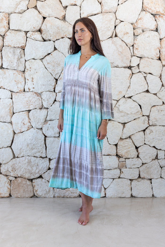 Womens super soft, lightweight, tunic style long length tie dye dress in aqua blue featuring 3/4 length trumpet sleeves and side pockets