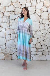 Womens super soft, lightweight, tunic style long length tie dye dress in aqua blue featuring 3/4 length trumpet sleeves and side pockets