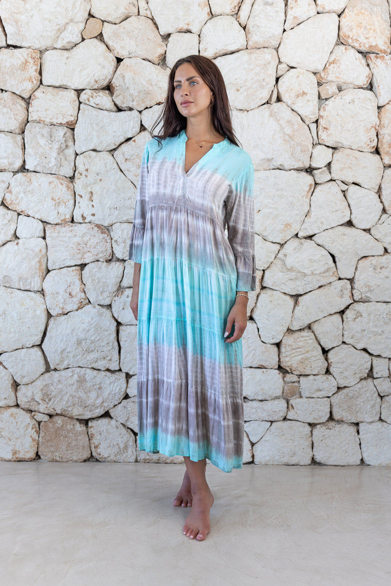 Womens super soft, lightweight, tunic style long length tie dye dress in aqua blue featuring 3/4 length trumpet sleeves and side pockets
